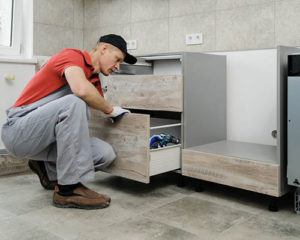 man remodeling kitchen in the house