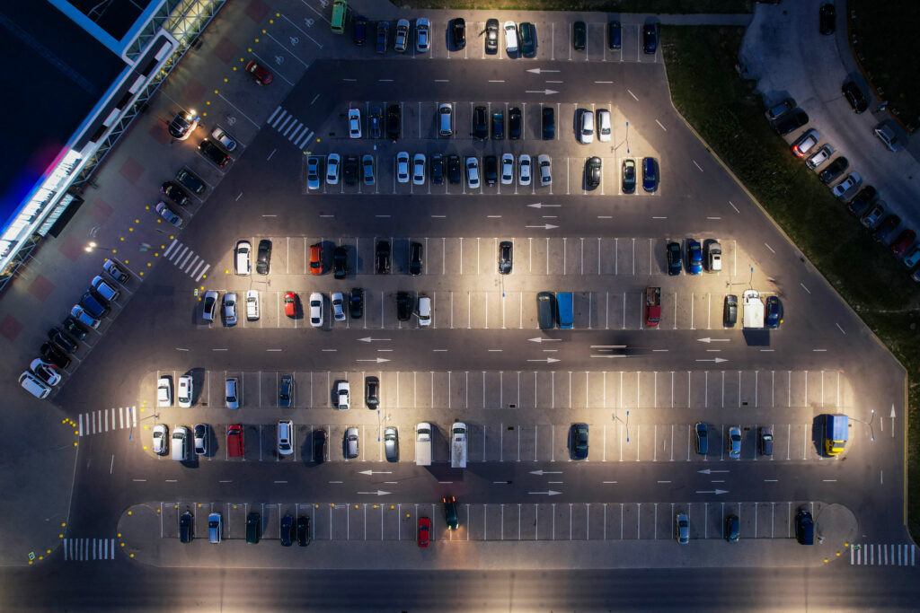 full parking lot illuminated at night