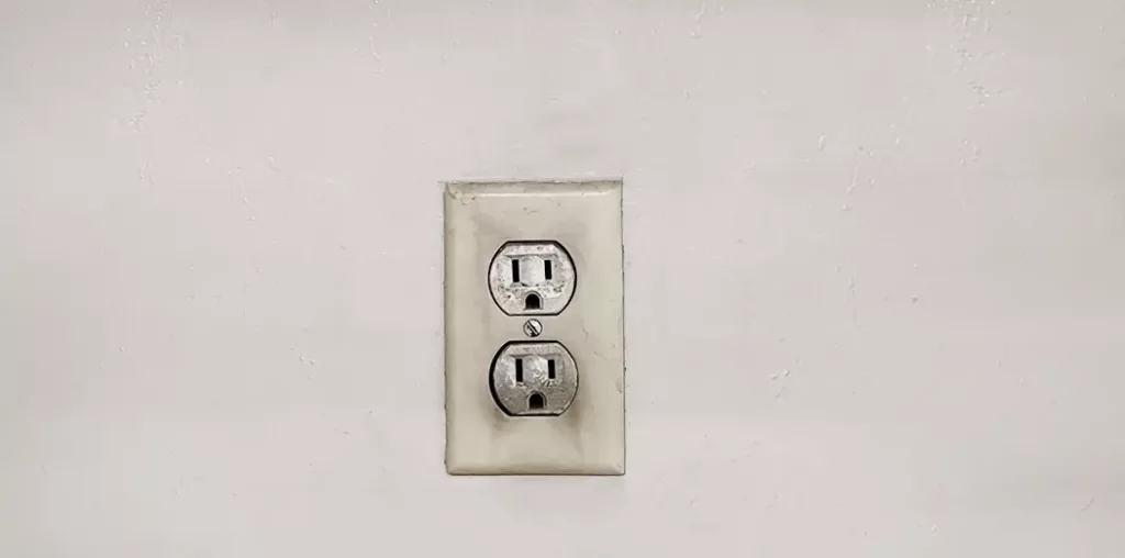 Scorched wall outlet